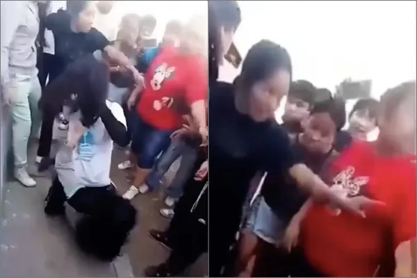 Captura de video donde se observa a las mujeres adultas impidiendo que terceros separen a las alumnas durante la riña en las inmediaciones de la secundaria en Tizayuca.