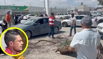 Vecinos de Mineral de la Reforma denunciaron que un hombre vestido con camiseta a rayas blancas con rojas estaba presuntamente armado al momento de amedrentar a los manifestantes.